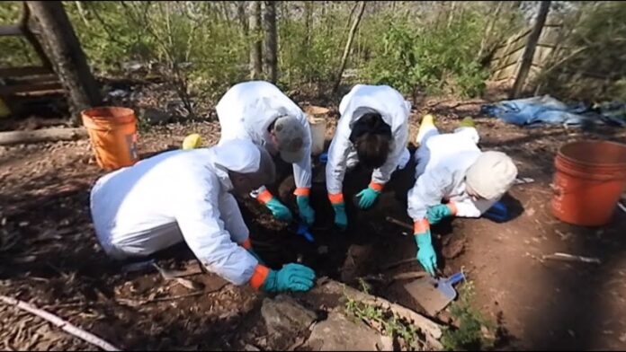 Forensics experts at the scene of the discovery at the River Stour in Sudbury one year ago - Credit: Archant